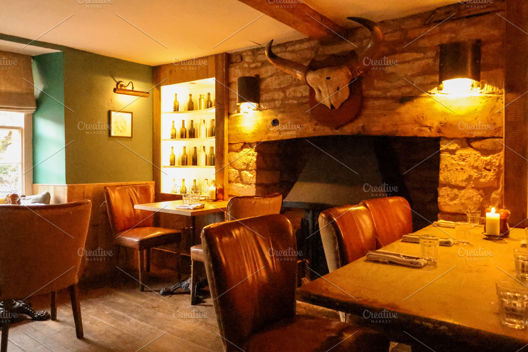 Warm light illuminating a rustic cozy restaurant interior with s, a Photo by Studio ANNA