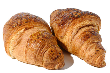 Baked croissant on a white isolated background, top view, a Food & Drink Photo by ndanko