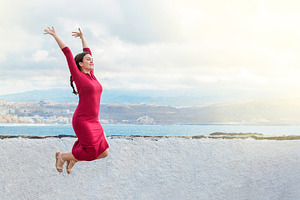 Beautiful woman jumping for joy