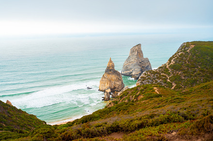 Praia Da Ursa Beach in summer day light, a Photo by andreonegin market