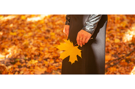 Woman with autumn leaves in her hand, a Nature Photo by yanadjana