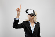 Businesswoman in VR headset touching virtual screen, exploring augmented realit, a Photo by Prostock-Studio (Thumbnail 2 of 2)