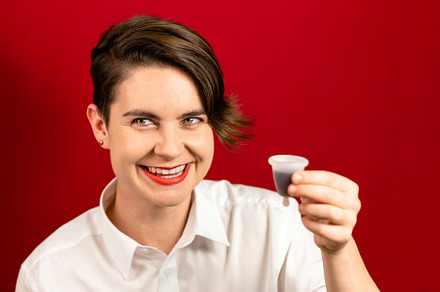 Woman holding a menstrual cup, a Health & Medical Photo by Andriana Syvanych