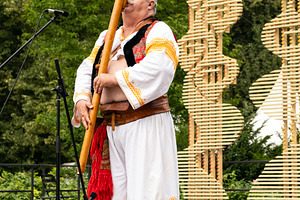 Man playing slovak fujara instrument, a Person Photo by BOOCYS