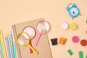 Stationery and school supplies such as pencils, magnifying glass, a School & Education Photo by ndanko