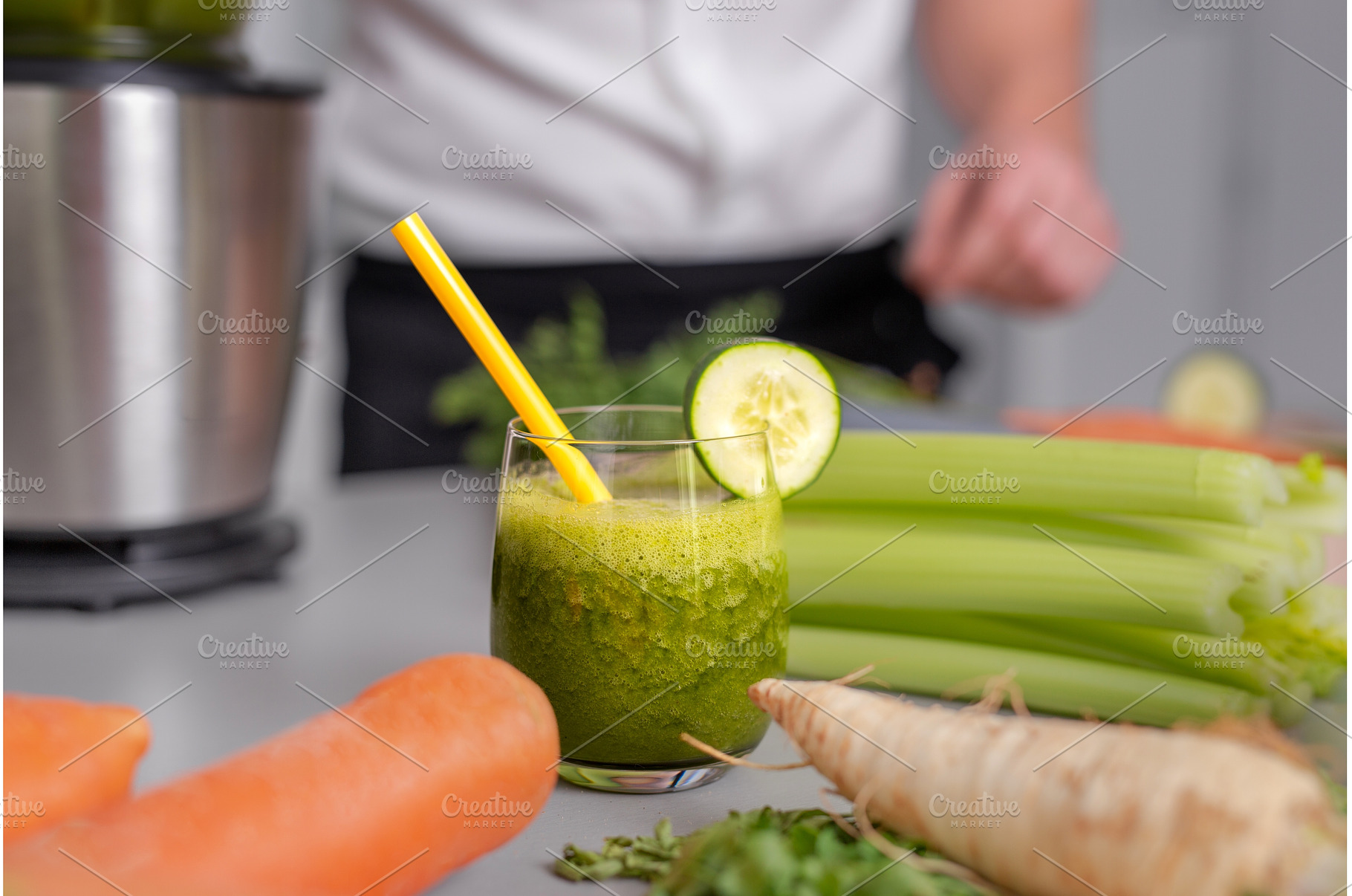Green smoothie in glass with straw, a Food & Drink Photo by HalfPoint