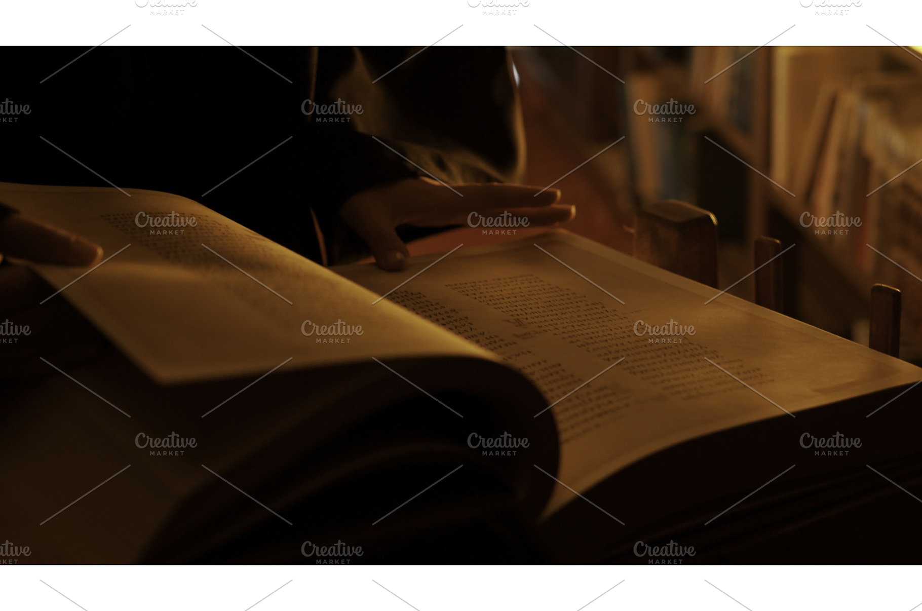 Man reading large mysterious book, a School & Education Photo by Media Whale Stock