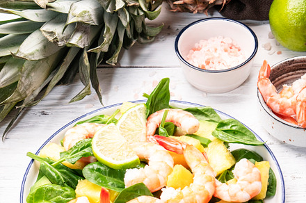 Pineapple shrimp salad with spinach, avocado and lime on white w, a Food & Drink Photo by 5PH