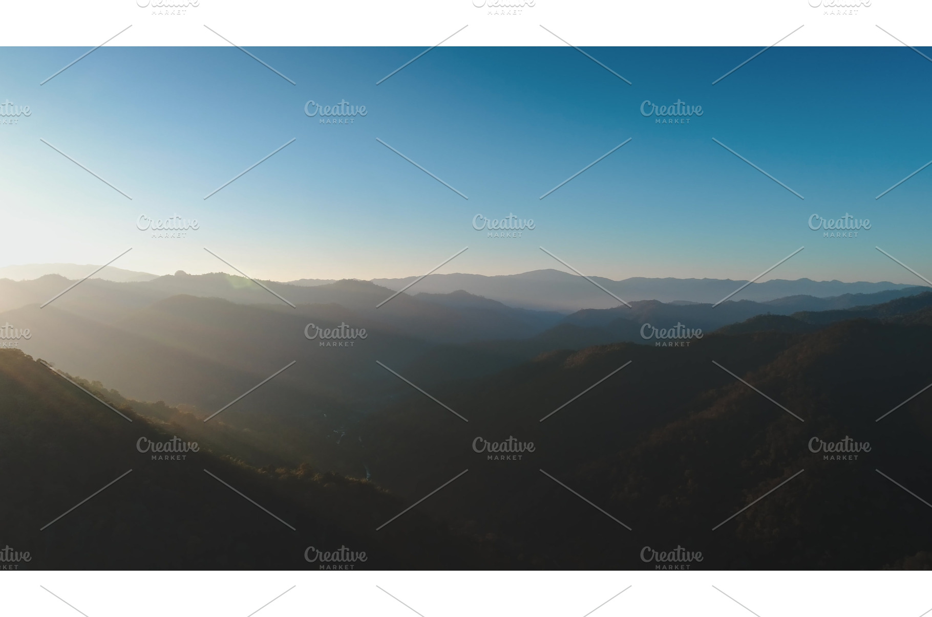 Sun shining over misty mountain, a Nature Photo by Goinyk