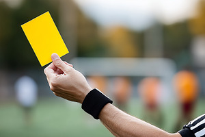 Referee in a striped shirt holding, a Sports & Recreation Photo by MistyDay