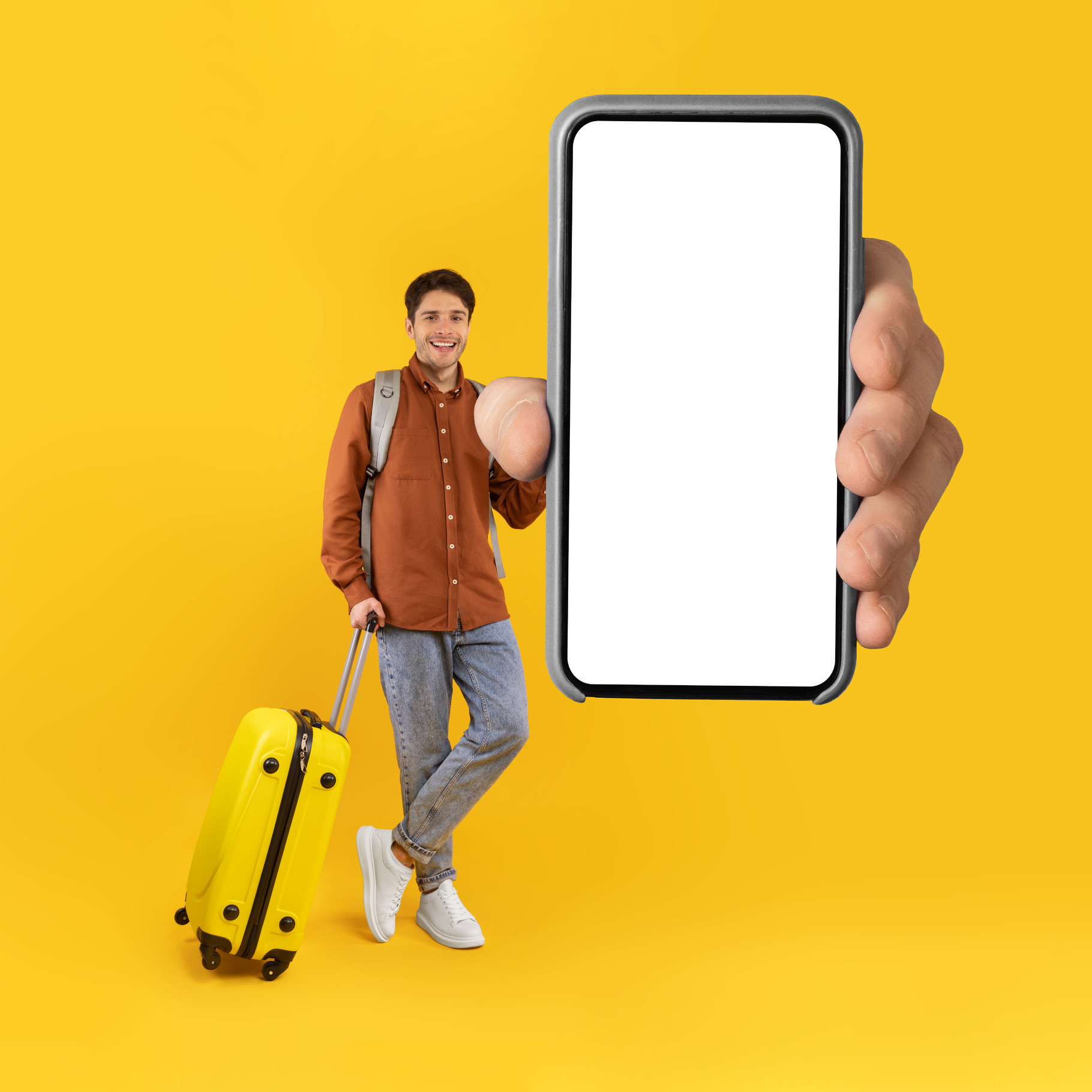 Tourist Man Showing Phone With Huge Blank Screen, Yellow Background, a ...