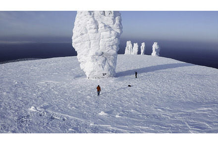 Winter desert with a walking tourist, a Sports & Recreation Photo by Media Whale Stock