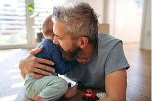 Father playing with little son with, a Person Photo by HalfPoint