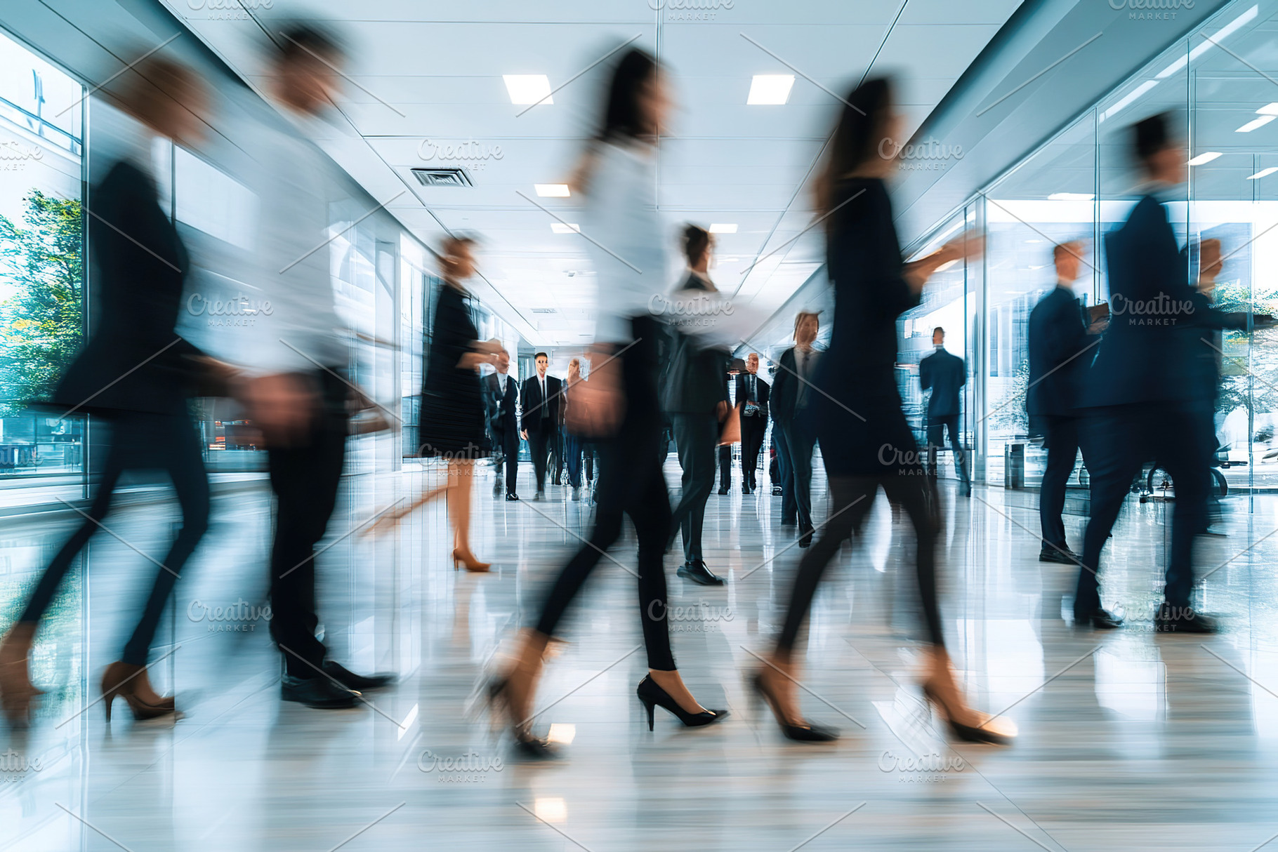 Busy office hallway with professionals in business attire walking, a Business Photo by AlyaAnd