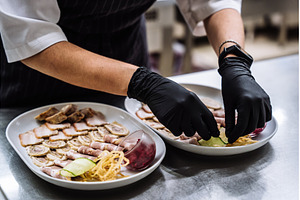 Professional chef in black gloves, a Food & Drink Photo by Red Hot Chili Pepper Shop