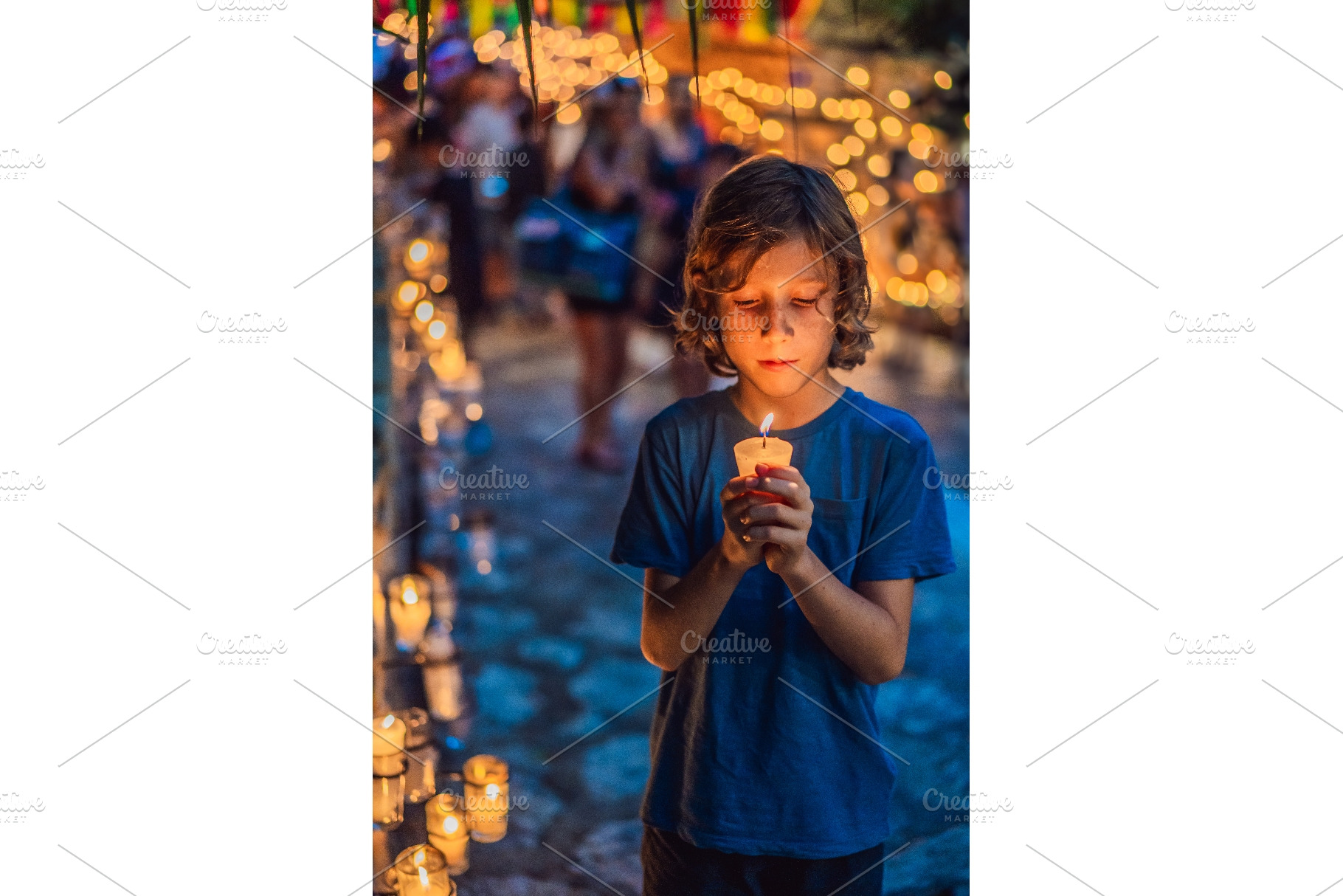 Boy quietly holding a candle during, a Person Photo by Elizaveta Galitskaya