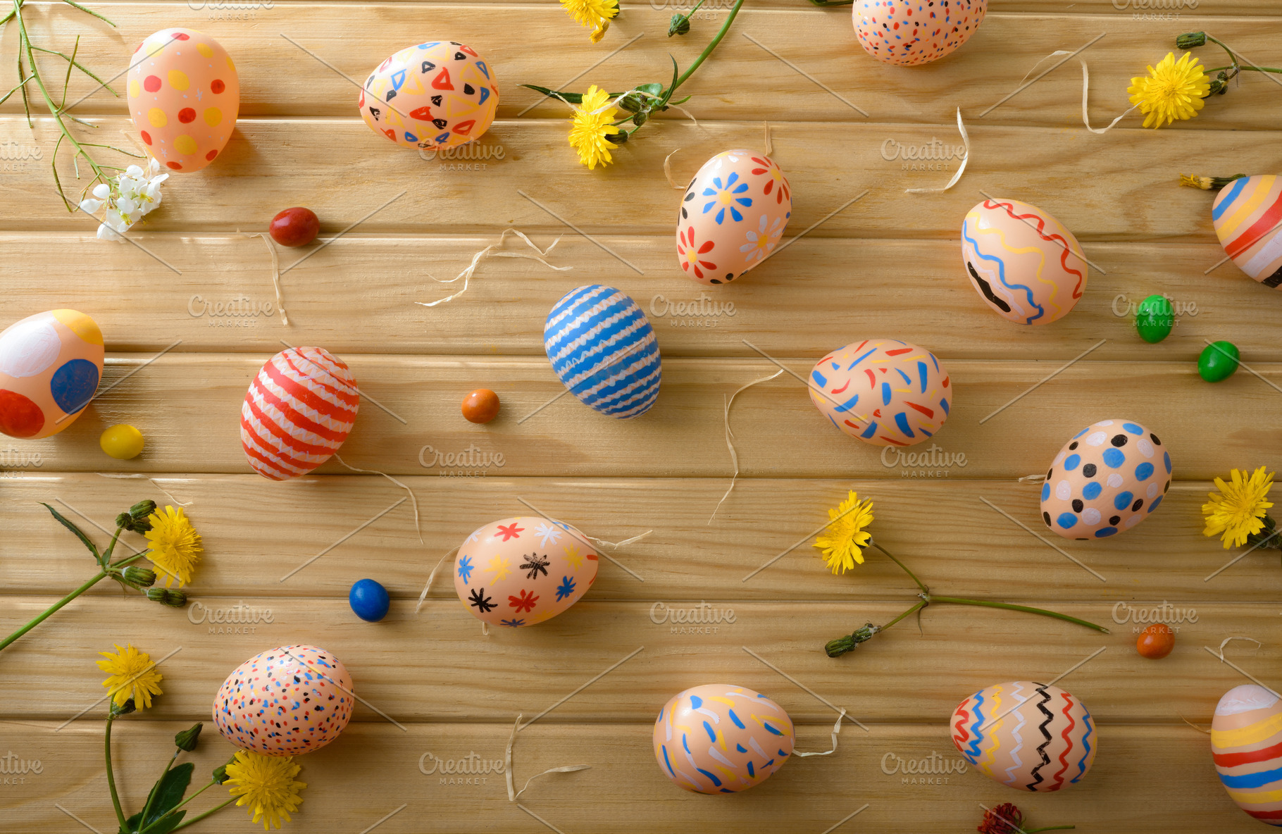 Scattered Colorful Easter Eggs on Wooden Background, a Holiday Photo by Davizro's Market