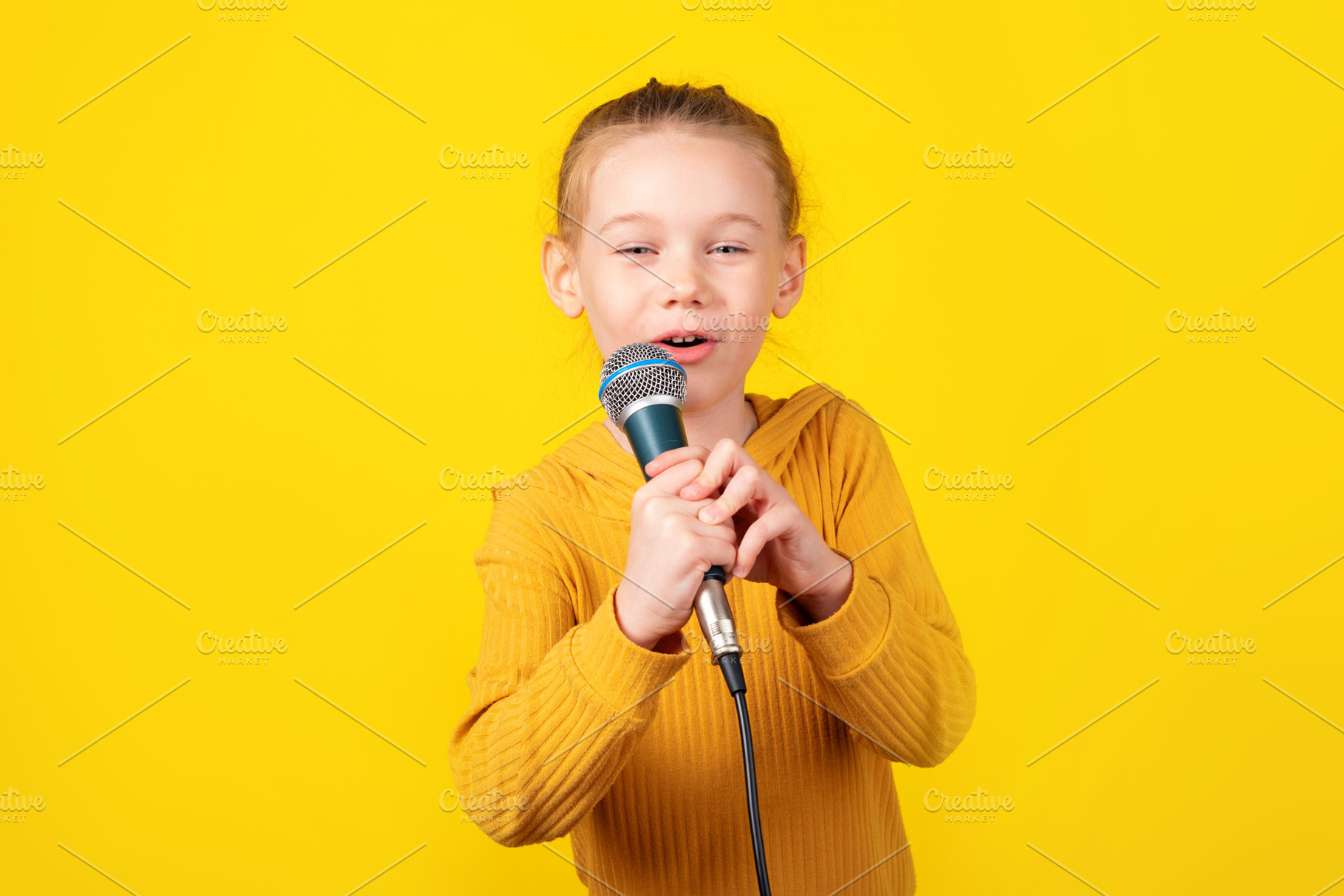 Child Singing with Microphone, a Person Photo by Ales Munt