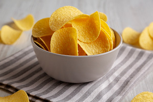 Potato Chips in a Bowl, side view. Close-up., a Food & Drink Photo by LiudmylaChuhunova
