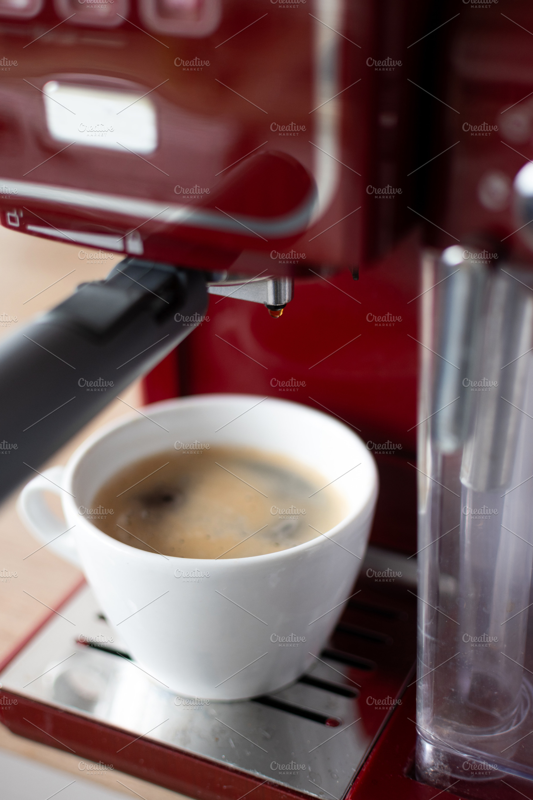 Fresh Espresso Coffee in White Cup Under Home Coffee Machine, a Person Photo by etorres69