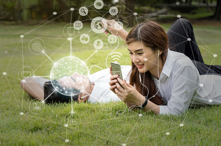 Happy asian couple using and listeni