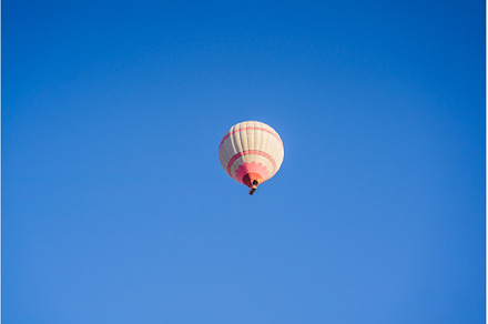 Beautiful hot air balloons over blue, a Transportation Photo by Elizaveta Galitskaya