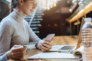 Woman using credit card