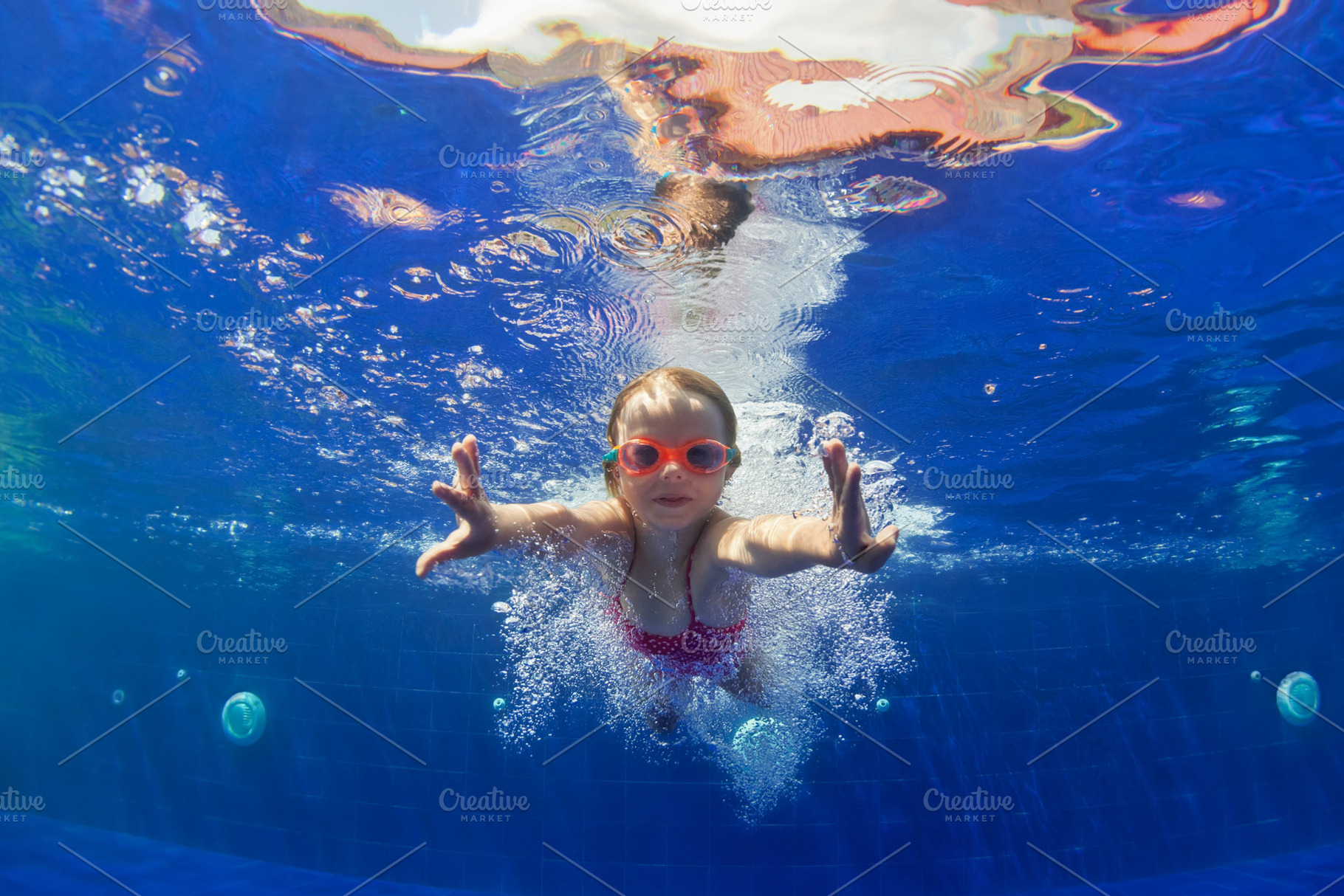 Funny child dive in swimming pool featuring swimming, pool, and child, a Sports & Recreation Photo by Tropical Studio