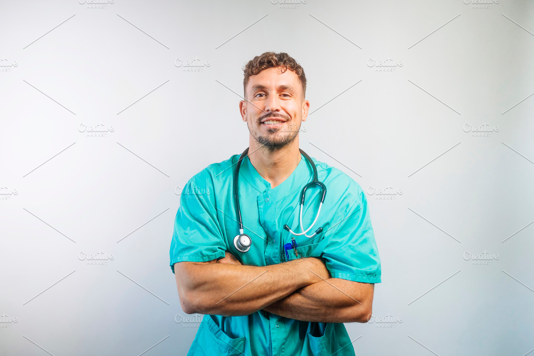 Happy Male Nurse or Doctor in Scrubs, a Person Photo by karrastock