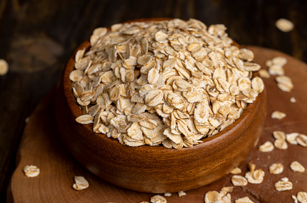 Oat flakes poured into a wooden bowl, a Food & Drink Photo by MyPhotos