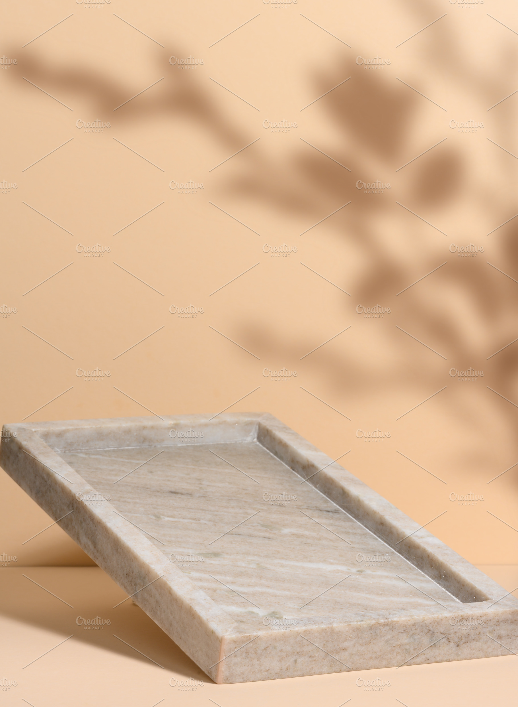 Empty marble rectangular food tray on beige background with shad, a Background Photo by ndanko