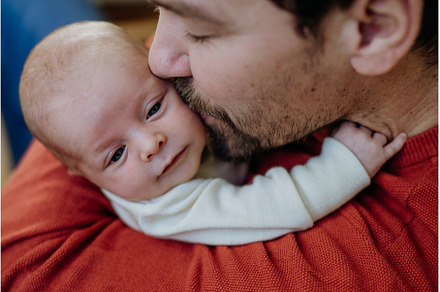 Close-up of father kissing his, a Person Photo by HalfPoint