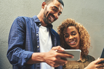We the type of couple that loves new applications, a Photo by Peopleimages.com