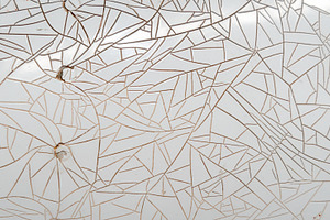 Cracked and peeling white plastic surface with intricate fractur, a Background Photo by GoodGoods