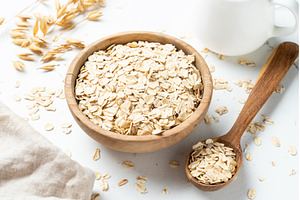 Rolled oats or oat flakes in a, a Food & Drink Photo by Nadia-nb