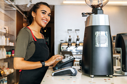 Female barista at counter, a Business Photo by Artem Varnitsin