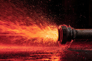 Fire hose releasing powerful water, a Photo by Pavel_design