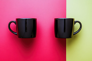 Black mugs on contrast, a Photo by Beautiful things