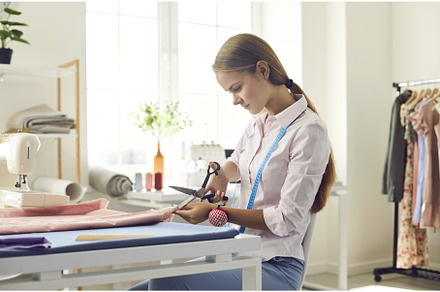 Focused seamstress with scissors, a Beauty & Fashion Photo by StudioRomantic