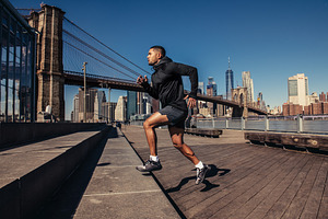 Athelte man running in New York City