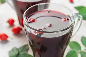 Drinking hot rosehip tea with berries and leaves, a Food & Drink Photo by Olena Rudo