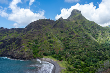 Coastal cliffs and turquoise bay near Puamau, Hiva Oa, Marquesas
