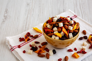Healthy Dried Fruit and Nut Mix in a Bowl, side view. Copy space, a Food & Drink Photo by LiudmylaChuhunova