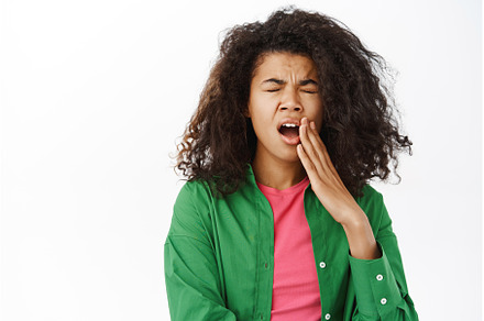 Tired african american woman yawning