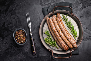 Juicy grilled sausage sizzling on the barbecue, perfect for summ, a Food & Drink Photo by composter-box@mail.ru