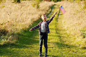 Little boy with USA flag outdoor. America celebrating., a Person Photo by AS photostudio