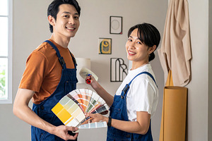 Interior decorators working together in a well lit home setting, a Person Photo by DanFLCreativo