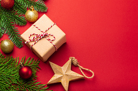 Christmas decorations, fir tree, present on red background copy, a Holiday Photo by its_al_dente
