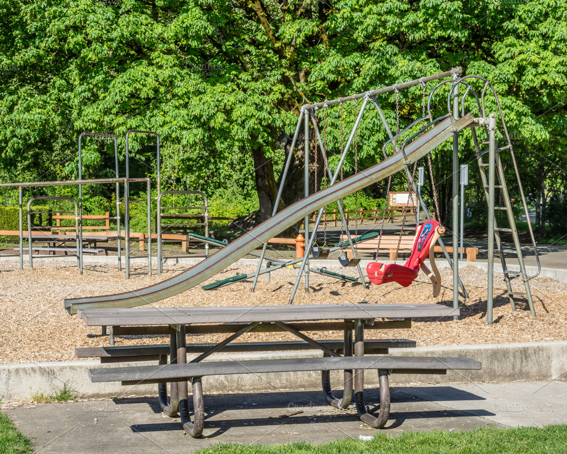 Playground in public park, an Architecture Photo by Zigzag Mountain Art