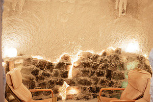Relaxing interior of a therapeutic salt cave with comfortable seating and soft, a Photo by AS photostudio